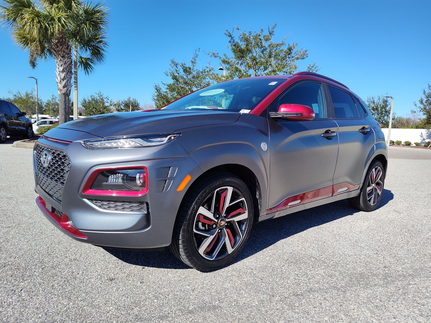 Hyundai Kona Iron Man Edition on a dealership lot, side glass visibly tinted.
